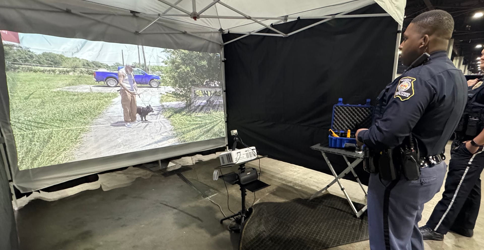 Police officer in training with a firearm simulator