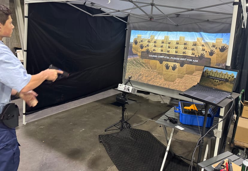 Law enforcement trainee completing a Smokeless Range simulator course