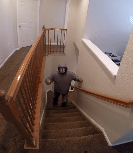 Simulator scenario: masked subject advancing down residential stairs